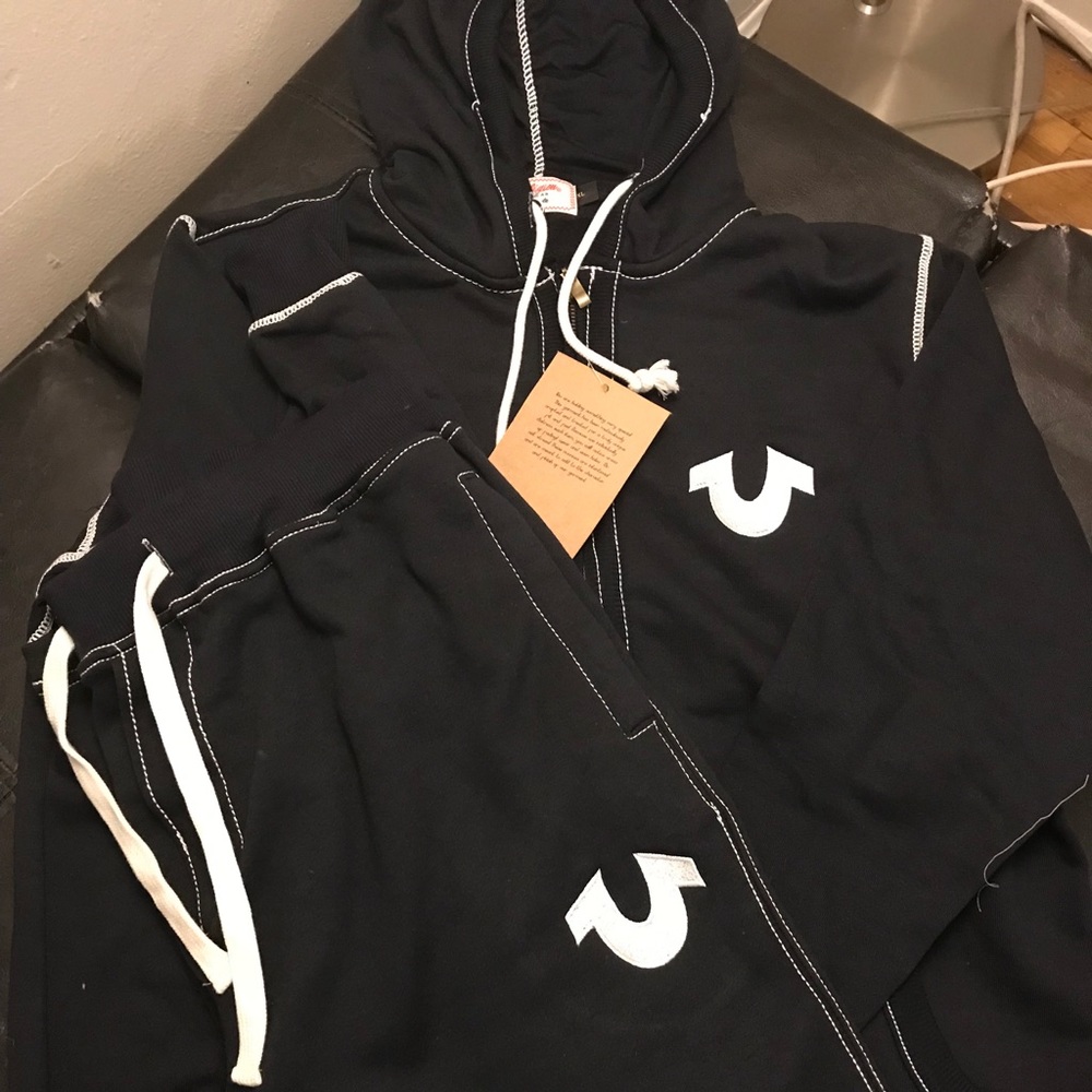 Black suit with white logo